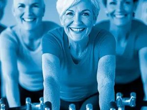 women on stationary bike